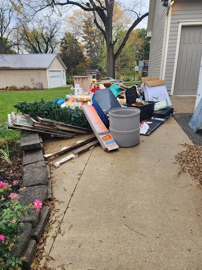 Dumpster being loaded with debris for Commercial Dumpster Rental in Bozeman